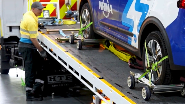 NRMA roadside assistance loading electric vehicle onto a tow truck