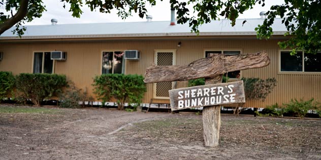Signs outside bunkhouse accommodation at Trilby Station, Louth