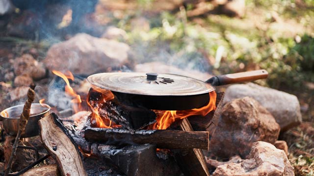 Frying pan over a campfire