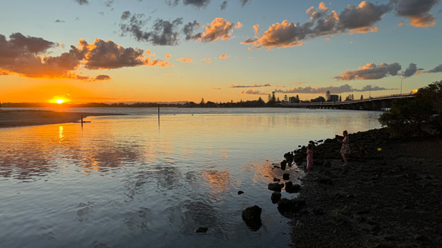 Forster at sunset with a view of the water
