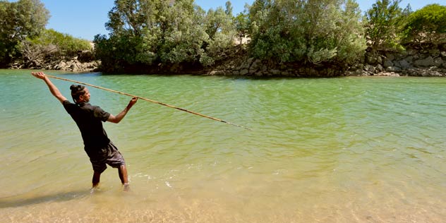 Jayden from Bunda Bunda Tours spearing fish