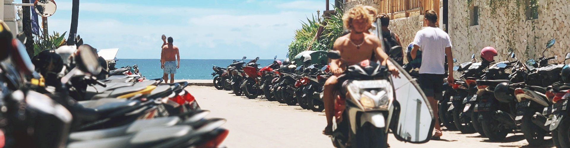 Young man rides moped without helmet