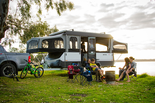 Group of people camping lakeside
