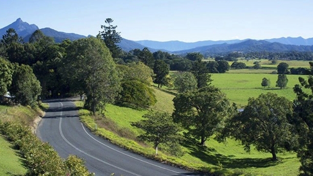 Gold Coast Hinterland QLD country road Winding road through the green fields of the Gold coast Hinterland on a sunny day