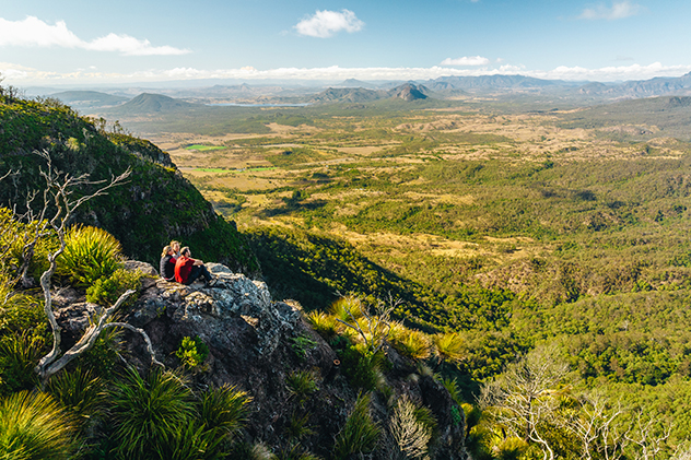 Two people sitting at a lookout