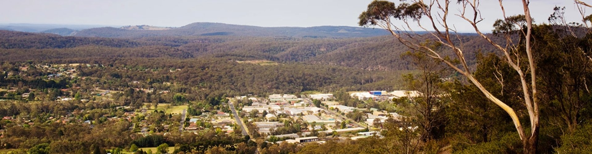Mittagong NSW arial arial view of Mittagong with tree covered hills in the background