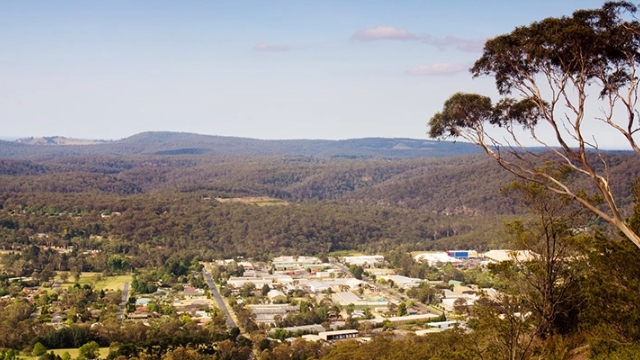 arial view of Mittagong with tree covered hills in the background
