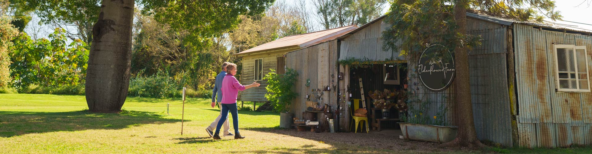 An older couple visits an Elderflower Farm in the Scenic Rim, South East Queensland