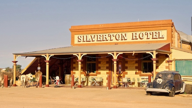 heritage sandstone building with wide veranda and painted signage Silverton Hotel