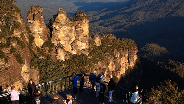 arial view of echo point lookout with people looking at the three sisters rock formations