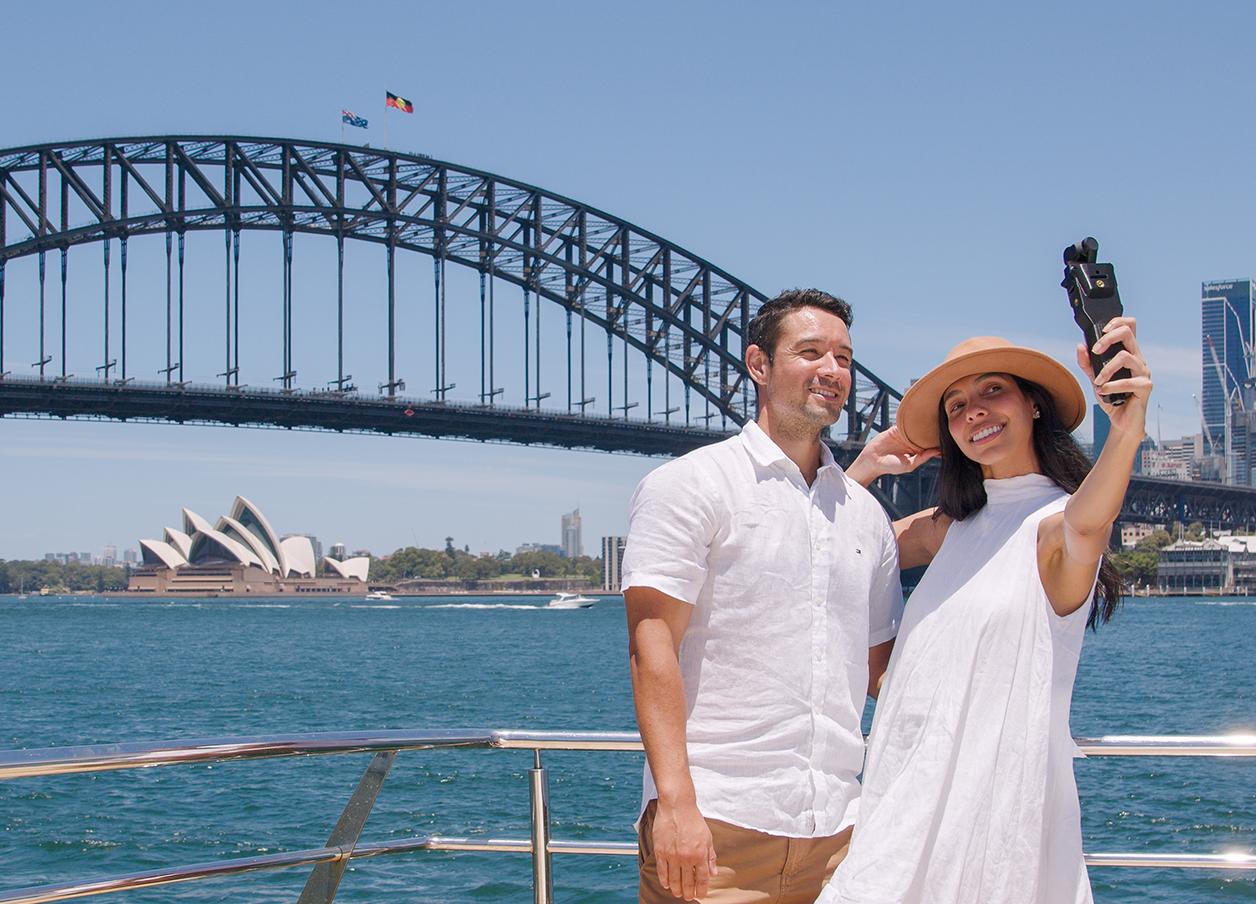 Fantasea Cruising couple overlooking Sydney Harbour Bridge