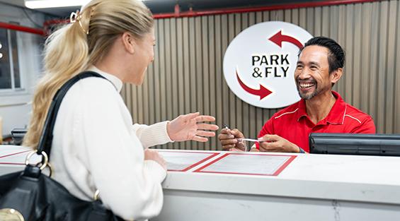 Park & Fly customer at counter