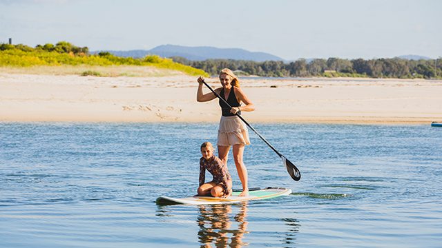 Paddle boarding at NRMA Forster Tuncurry Holiday Park