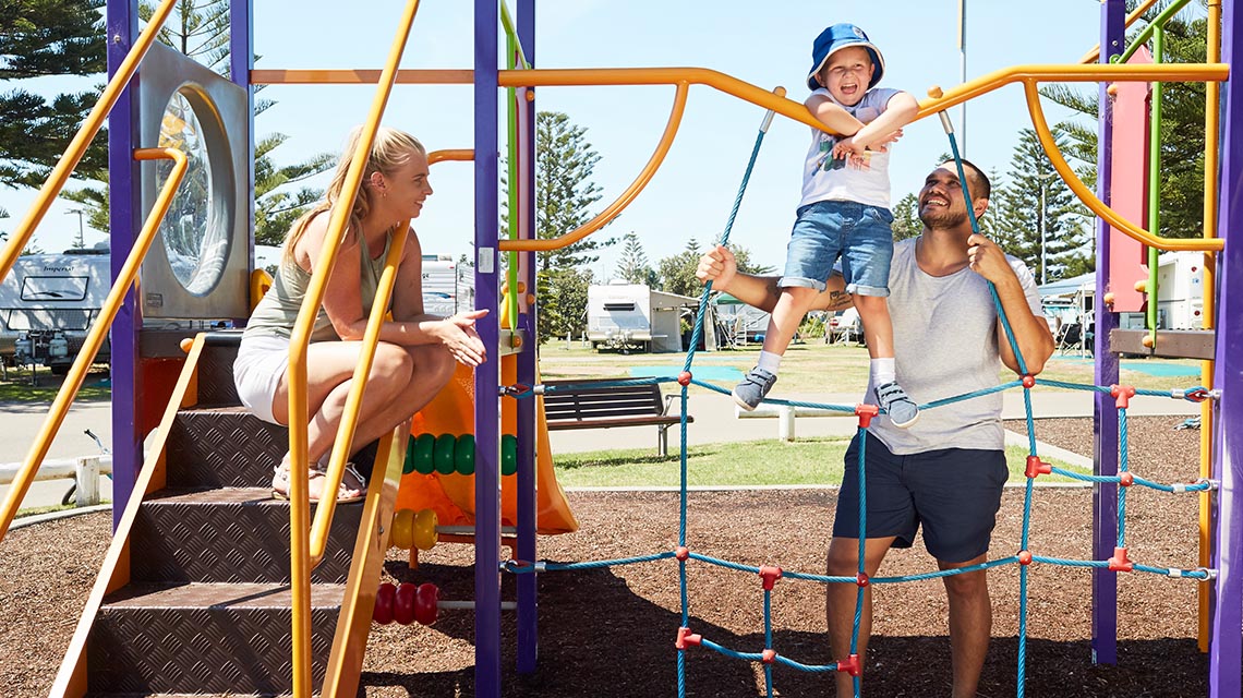 family on playground NRMA Stockton Beach Holiday Park NSW my nrma local guides