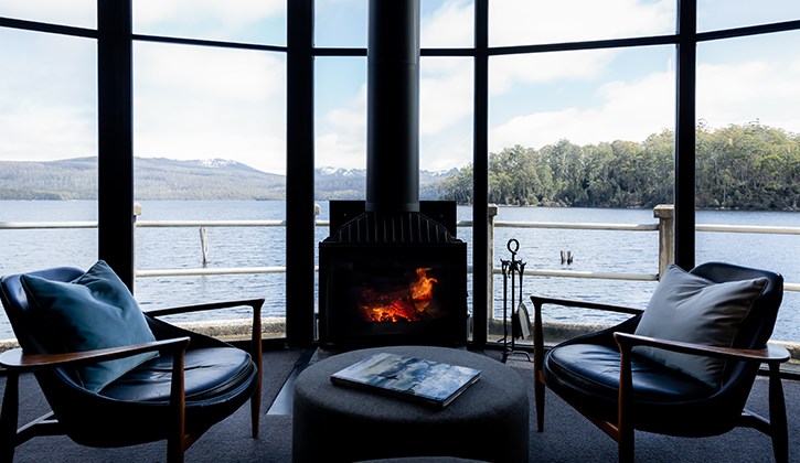 Warm up by the log fire at Pumphouse Point