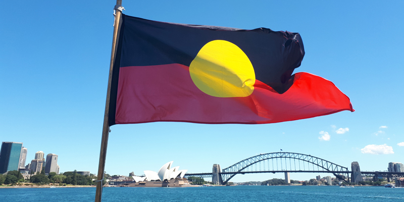 Aboriginal flag with the Sydney Harbour Bridge in the background