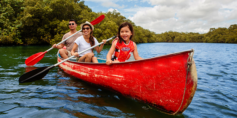 Family canoeing on Brunswick River, Brunswick Heads on the Northern Rivers of NSW. Family canoeing on Brunswick River, Brunswick Heads on the Northern Rivers of NSW.