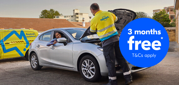 RSA employee fixing vehicle while customer is in the vehicle