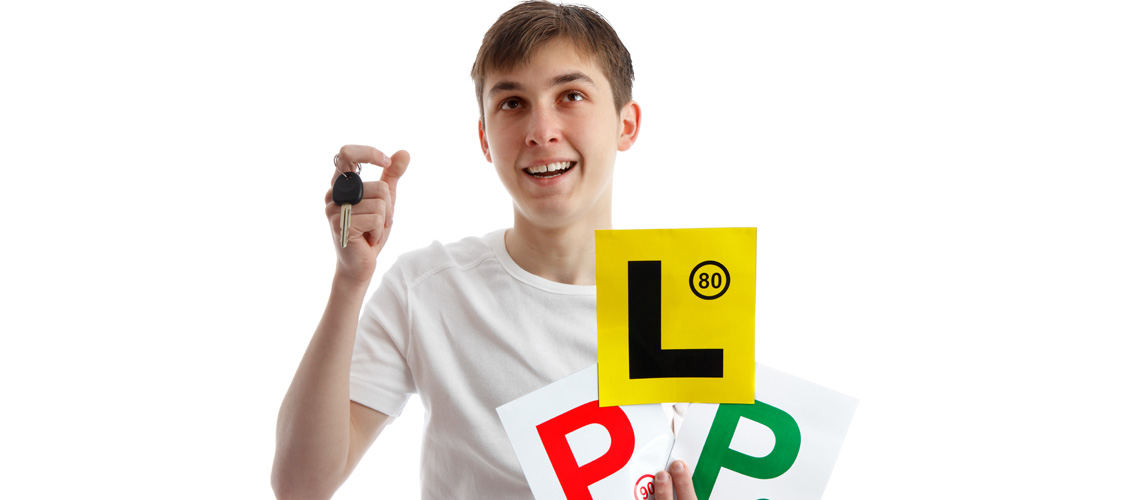Teenager holding P and L plates