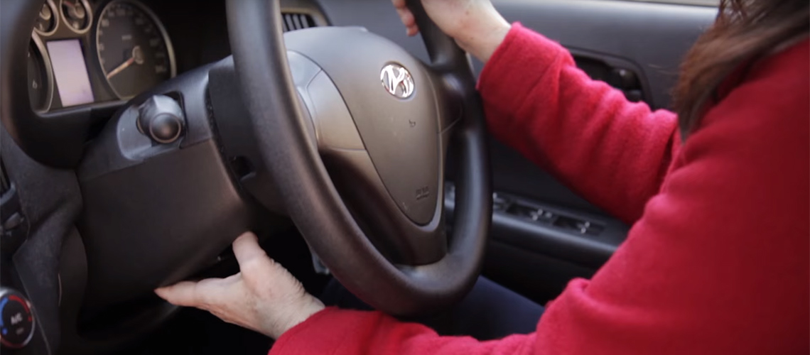 Optimal driving position behind steering wheel
