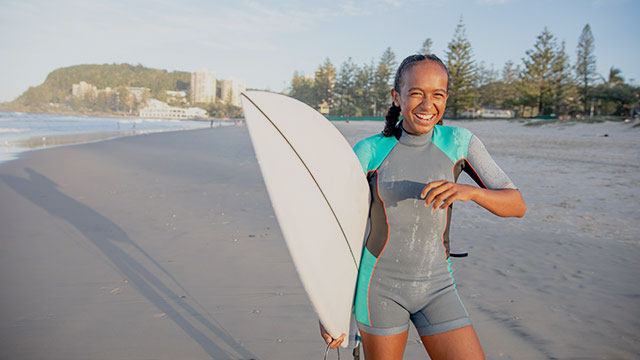 Discover Australia girl surfer on beach