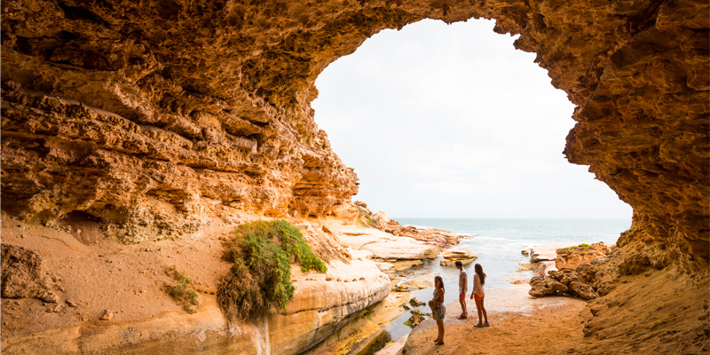 3 people exploring the Woolshed Cave in South Australia